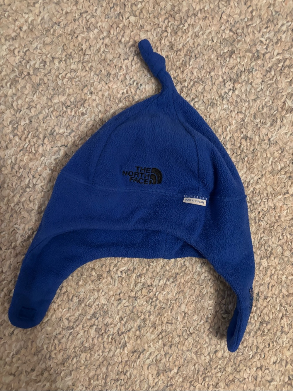 The North Face Royal Blue Fleece Earflap Hat with Knotted Top